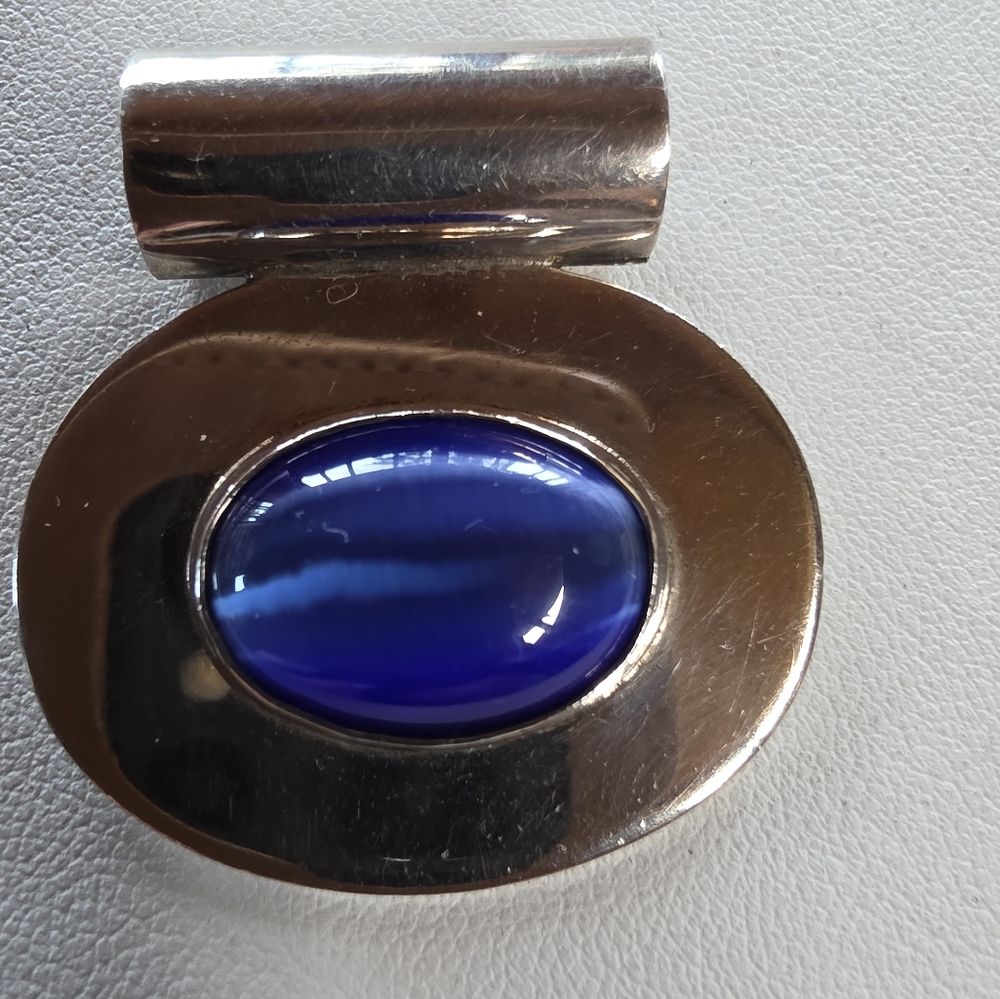 Sterling Silver Pendant With Vibrant Blue Cat's Eye Stone.